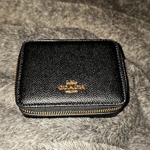 Small tech/jewelry case or whatever you to put in it. Gen. Cross grain leather.